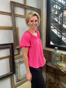 everly puffy sleeve short sleeve hot pink round neck button down top paired with black jeans