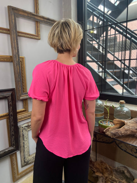 everly puffy sleeve short sleeve hot pink round neck button down top paired with black jeans