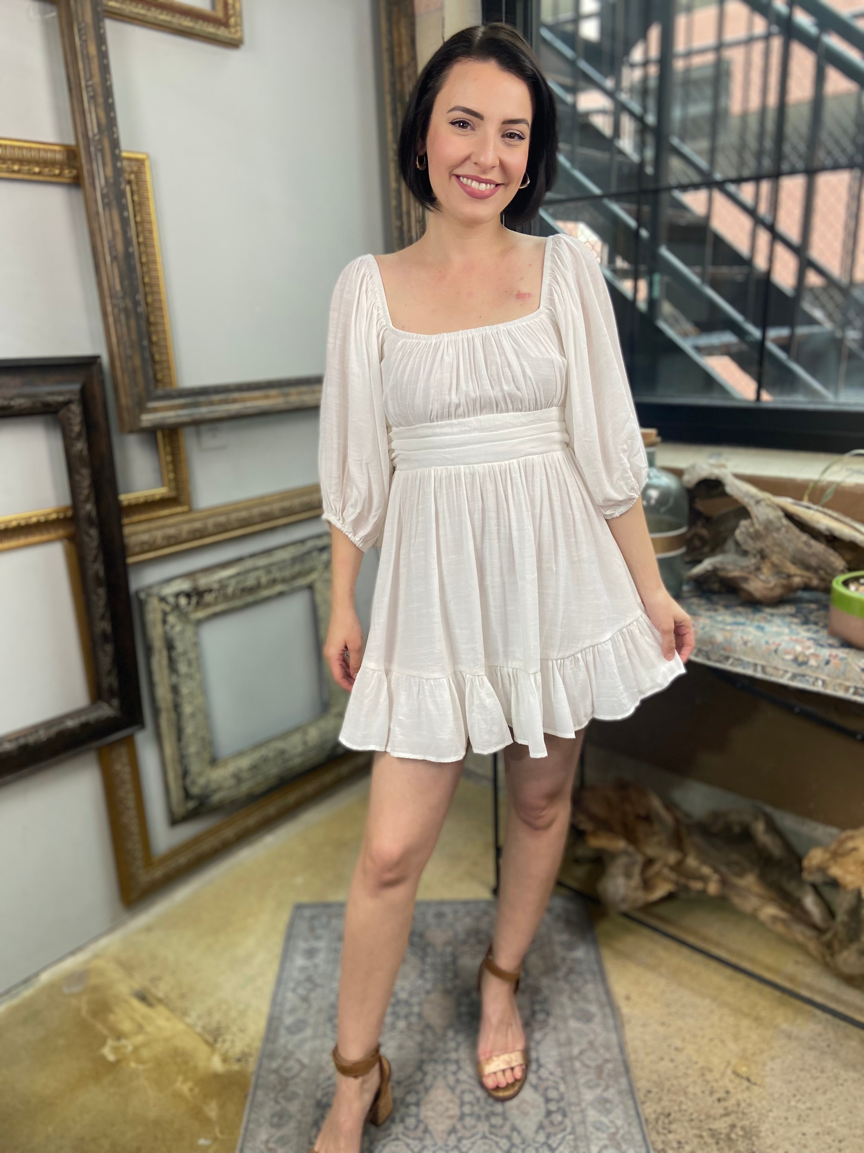 Expertly crafted in a versatile white hue, the Eve White Open Back Mini Dress features a trendy off-shoulder design with a flirty open back and a charming tie closure. Its ruffle-trimmed hem and three-quarter length sleeves create an effortlessly chic look, while the slip lining ensures a comfortable fit. Perfect for any occasion, this dress offers both style and comfort.



Off-shoulder open-back dress

Elegant and stylish design

Made with soft, breathable fabric