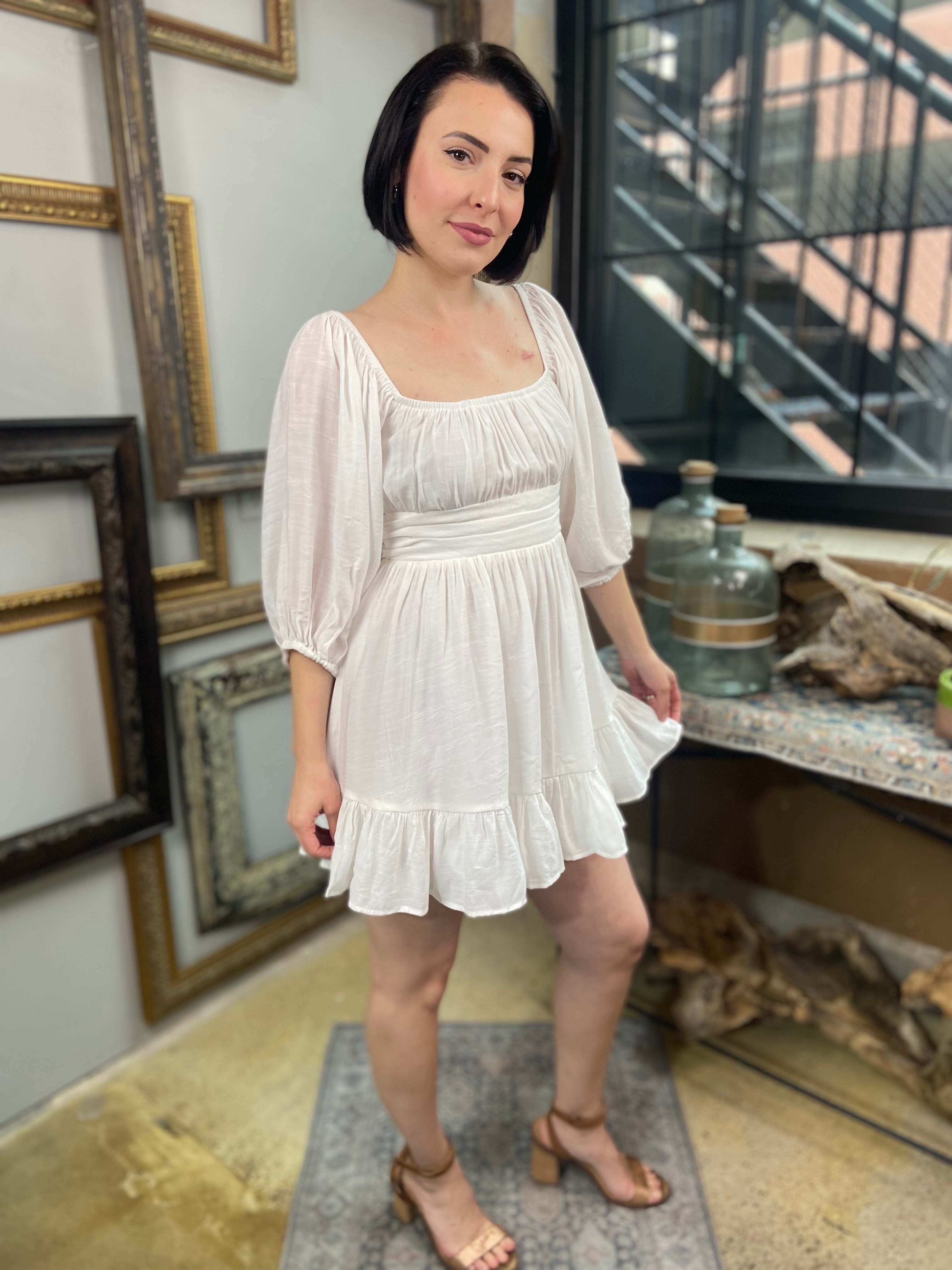 Expertly crafted in a versatile white hue, the Eve White Open Back Mini Dress features a trendy off-shoulder design with a flirty open back and a charming tie closure. Its ruffle-trimmed hem and three-quarter length sleeves create an effortlessly chic look, while the slip lining ensures a comfortable fit. Perfect for any occasion, this dress offers both style and comfort.



Off-shoulder open-back dress

Elegant and stylish design

Made with soft, breathable fabric