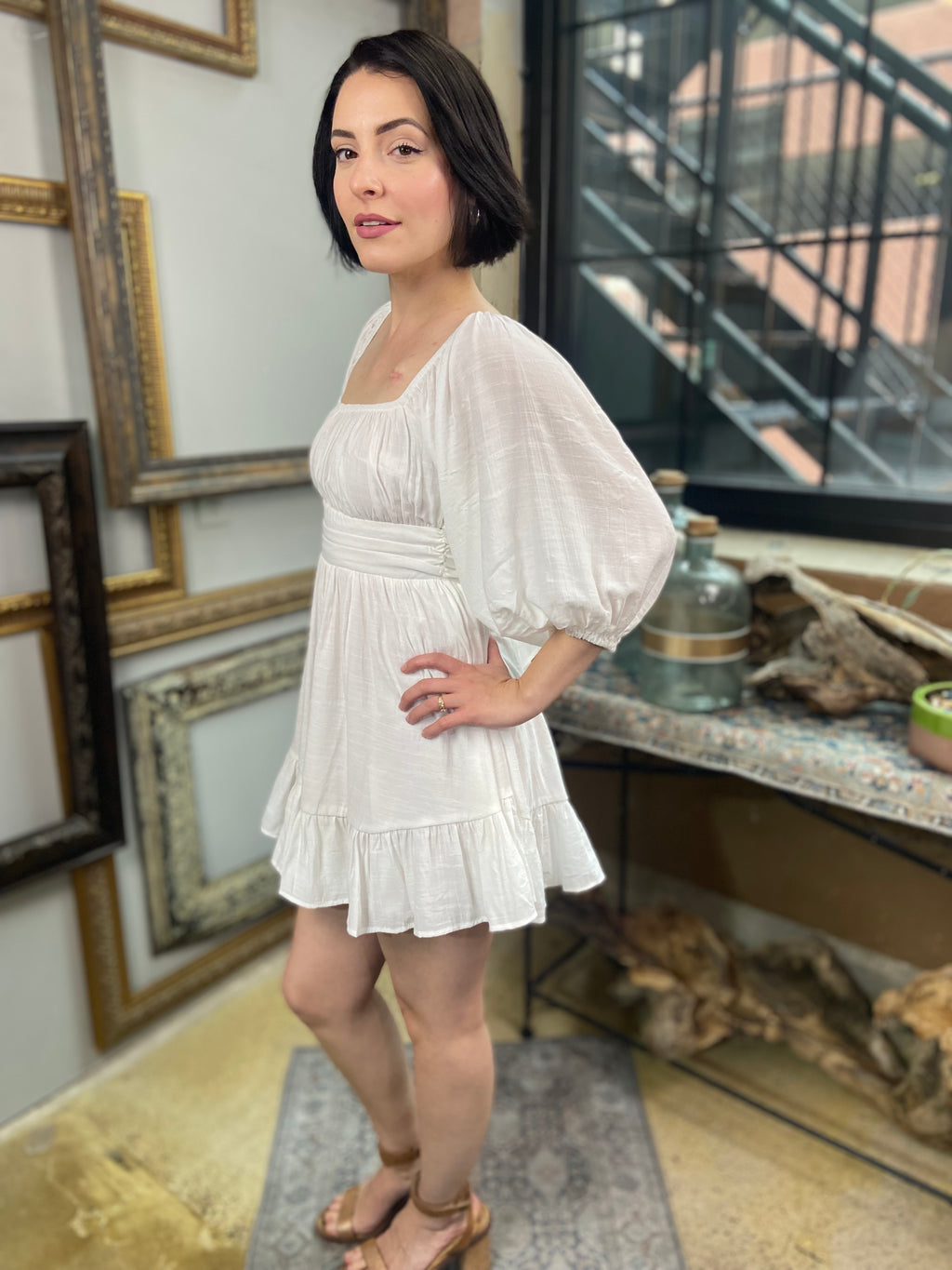 Expertly crafted in a versatile white hue, the Eve White Open Back Mini Dress features a trendy off-shoulder design with a flirty open back and a charming tie closure. Its ruffle-trimmed hem and three-quarter length sleeves create an effortlessly chic look, while the slip lining ensures a comfortable fit. Perfect for any occasion, this dress offers both style and comfort.



Off-shoulder open-back dress

Elegant and stylish design

Made with soft, breathable fabric