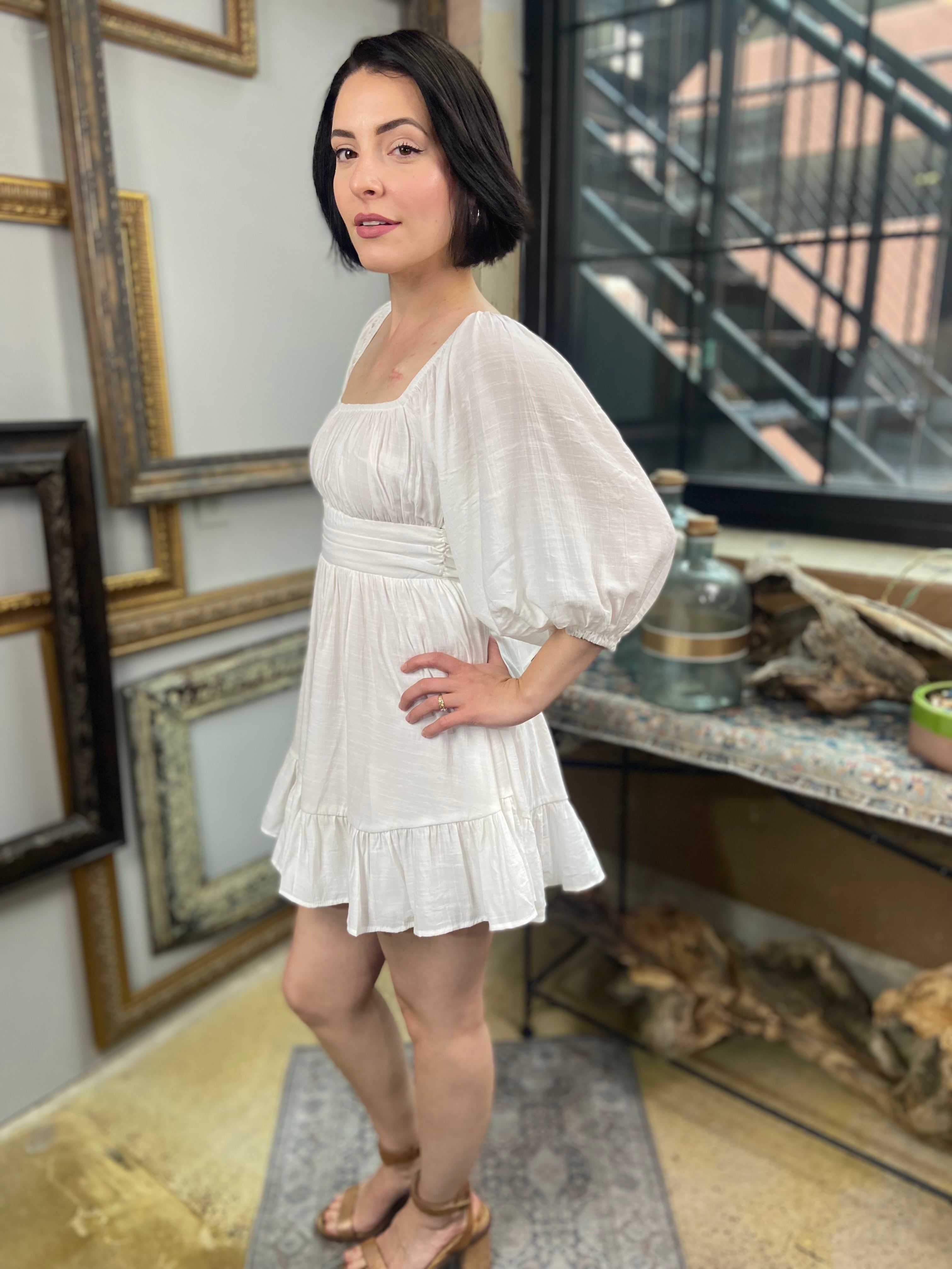 Expertly crafted in a versatile white hue, the Eve White Open Back Mini Dress features a trendy off-shoulder design with a flirty open back and a charming tie closure. Its ruffle-trimmed hem and three-quarter length sleeves create an effortlessly chic look, while the slip lining ensures a comfortable fit. Perfect for any occasion, this dress offers both style and comfort.



Off-shoulder open-back dress

Elegant and stylish design

Made with soft, breathable fabric