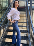 faye boot cut mid rise dark wash jeansd paired with white button up