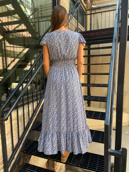 isabella blue floral ditsy long cap sleeve v neck button down dress with drawstring waist a line high low blue and white floral dress