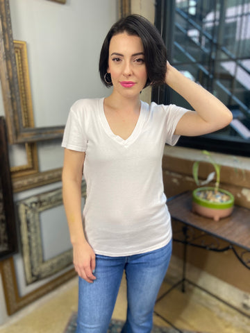 classic white v neck solid t shirt long fitted paired with jeans