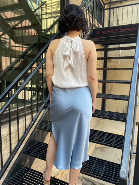 Elevate your wardrobe with the Kallie Light Blue Satin Skirt. This stunning piece features a soft satin finish that drapes beautifully, making it perfect for any occasion—be it a casual outing or an evening gala. Its light blue hue adds a touch of elegance and versatility, allowing you to pair it effortlessly with various tops and accessories.

- Luxurious satin fabric for a smooth feel
- Flattering silhouette that enhances your figure
- Easy to style for both day and night looks
- Ideal for layering or wea