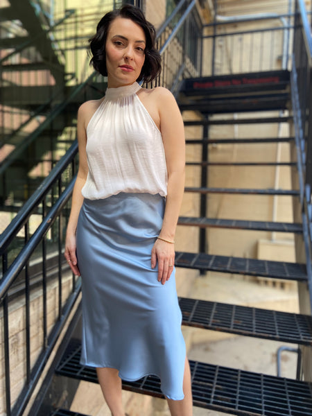 Elevate your wardrobe with the Kallie Light Blue Satin Skirt. This stunning piece features a soft satin finish that drapes beautifully, making it perfect for any occasion—be it a casual outing or an evening gala. Its light blue hue adds a touch of elegance and versatility, allowing you to pair it effortlessly with various tops and accessories.

- Luxurious satin fabric for a smooth feel
- Flattering silhouette that enhances your figure
- Easy to style for both day and night looks
- Ideal for layering or wea