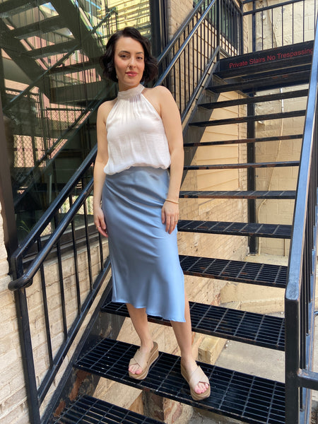 Elevate your wardrobe with the Kallie Light Blue Satin Skirt. This stunning piece features a soft satin finish that drapes beautifully, making it perfect for any occasion—be it a casual outing or an evening gala. Its light blue hue adds a touch of elegance and versatility, allowing you to pair it effortlessly with various tops and accessories.

- Luxurious satin fabric for a smooth feel
- Flattering silhouette that enhances your figure
- Easy to style for both day and night looks
- Ideal for layering or wea