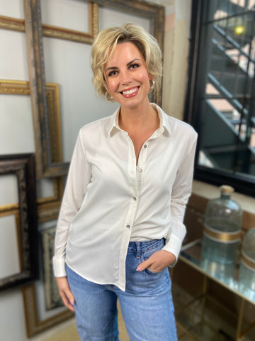 white button up white collared button down paired with jeans