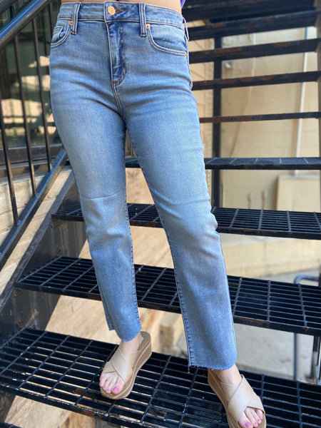 lenox straight leg light wash jeans mid rise raw hem jeans paired with light blue button up