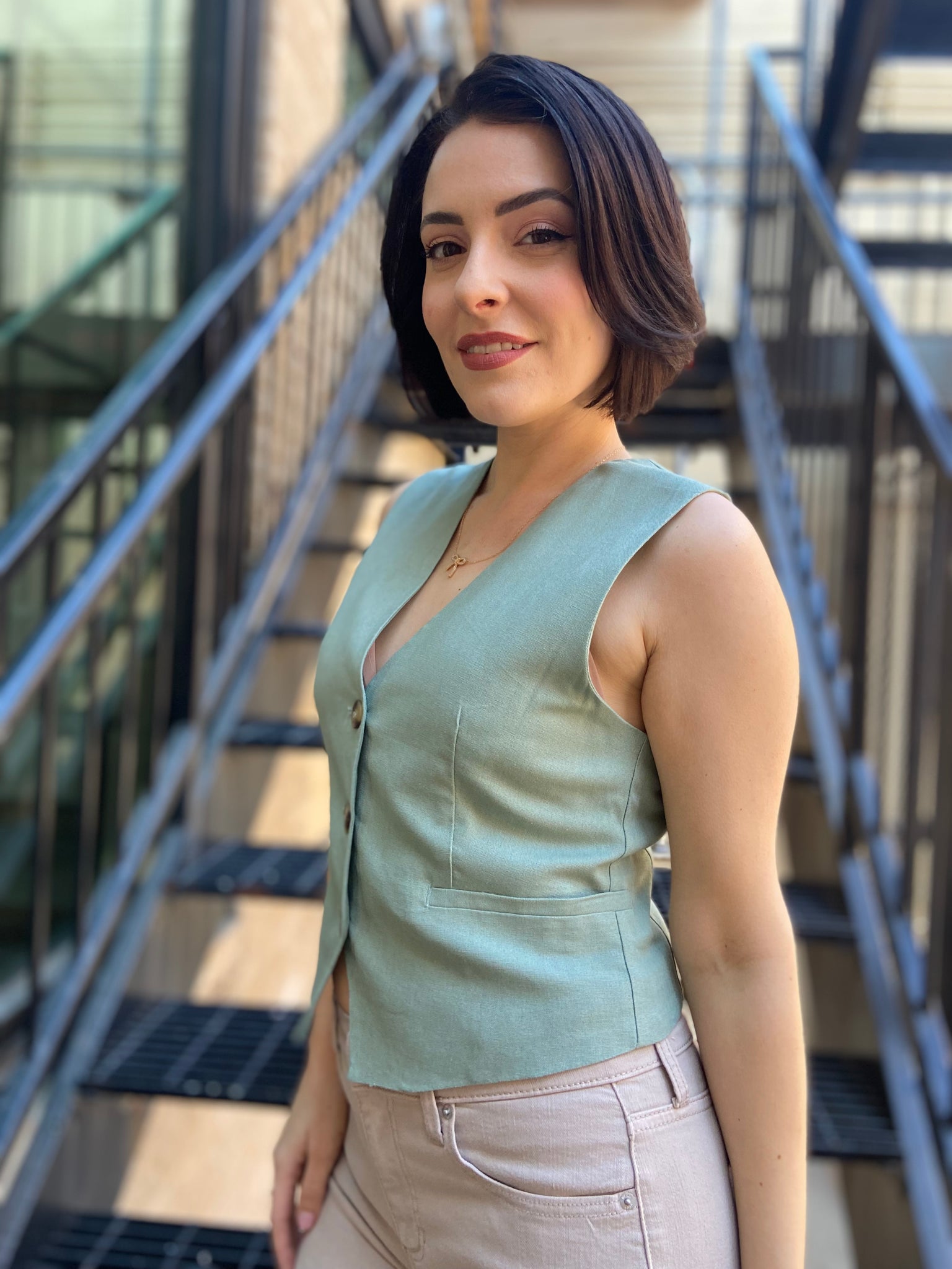 leslie mint green blazer linen vest paired with cream jeans