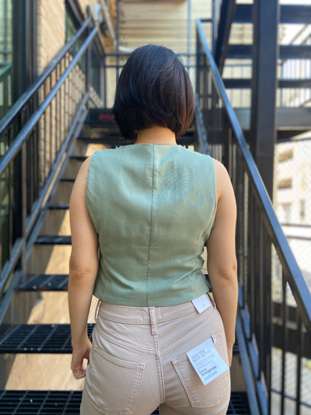 leslie mint green blazer linen vest paired with cream jeans