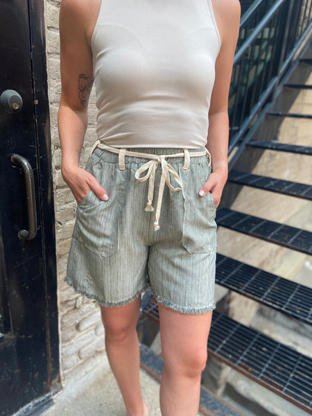 lewis cream and green front tie elastic waist shorts long shorts pockets paired with cream top