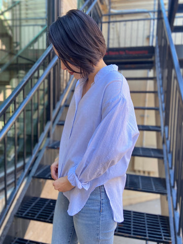 lizzy blue and white stripe linen button up paired with jeans