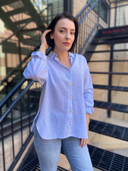 lizzy blue and white stripe linen button up paired with jeans