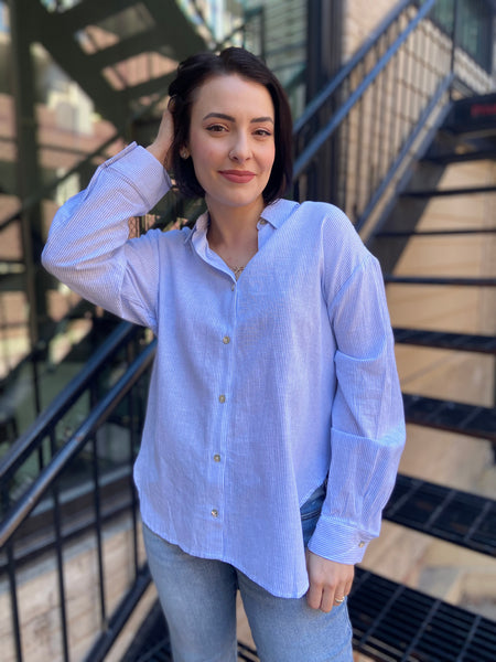 lizzy blue and white stripe linen button up paired with jeans