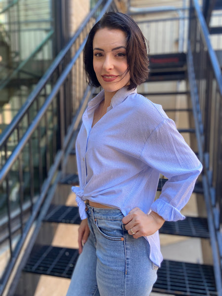 lizzy blue and white stripe linen button up paired with jeans