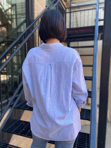 lizzy blue and white stripe linen button up paired with jeans