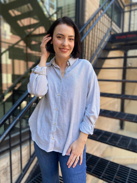 lizzy mint green striped linen button up paired with jeans