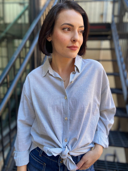 lizzy mint green striped linen button up paired with jeans