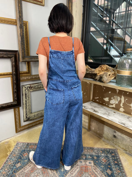 dark wash denim blue overalls jumpsuit wide leg spaghetti straps pockets front and back back view