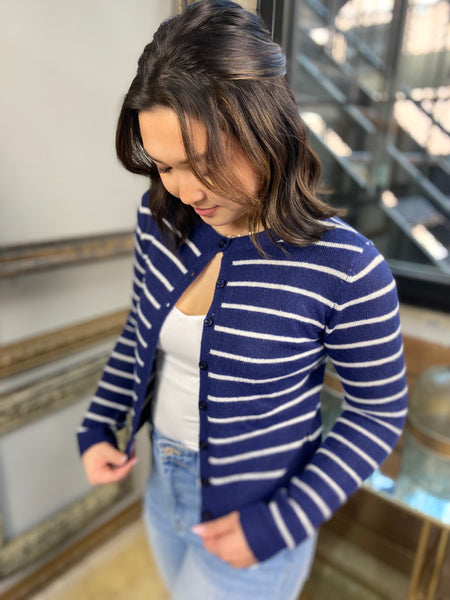 white and navy striped button down cardigan crew neck knit paired with white tank top and jeans side view