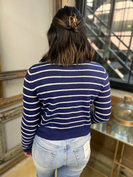 white and navy striped button down cardigan crew neck knit paired with white tank top and jeans back view