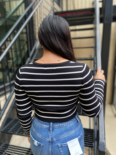 black and white striped cropped fitted sweater back view with jeans