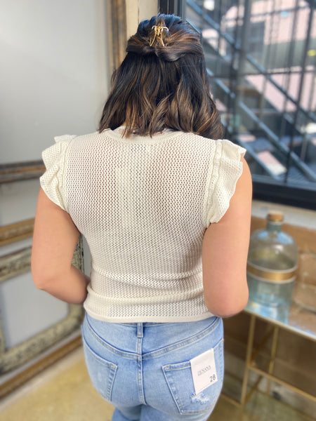 white and navy striped button down cardigan crew neck knit paired with white tank top and jeans back view