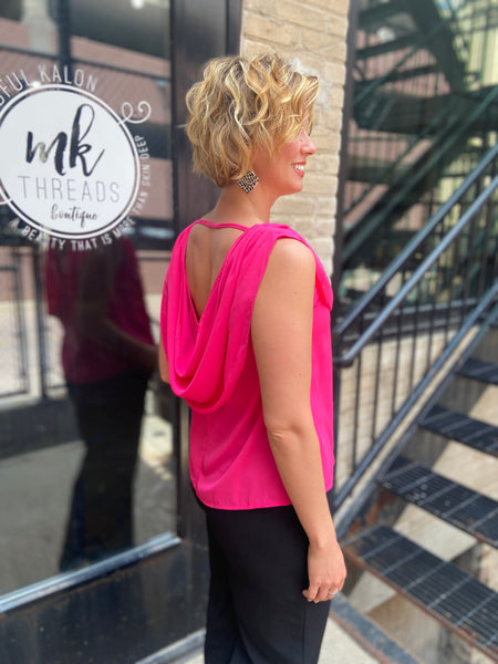 osbourne hot pink drop neck sleeveless tank top paired with black jeans