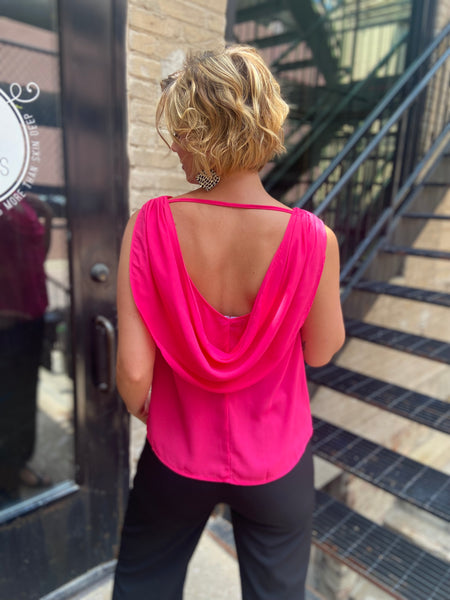 osbourne hot pink drop neck sleeveless tank top paired with black jeans