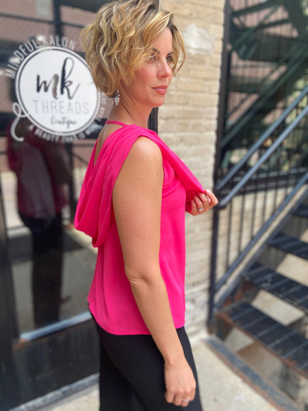 osbourne hot pink drop neck sleeveless tank top paired with black jeans