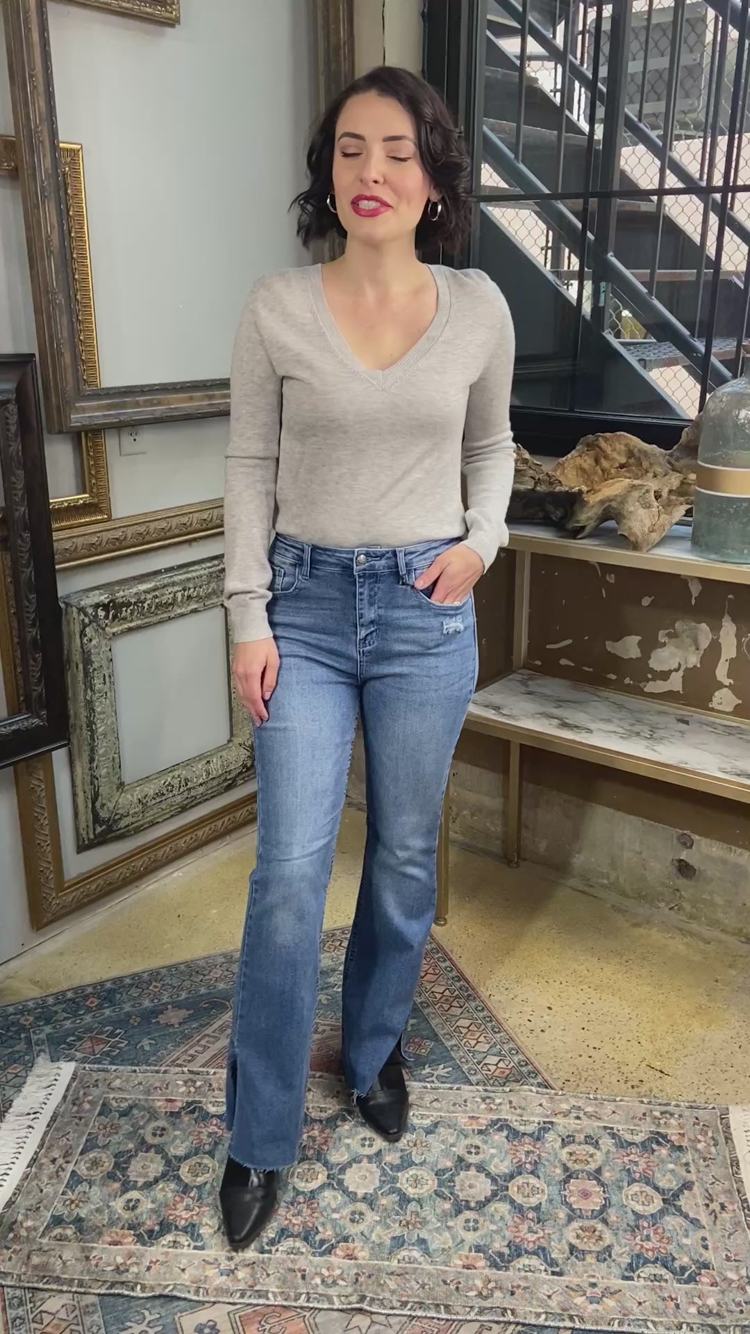 jelly jeans flare dark to medium wash paired with gray long sleeve