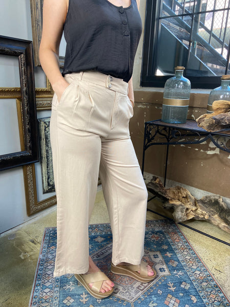 sylvie khaki linen pants with pockets double button linen pants paired with black blouse shirt