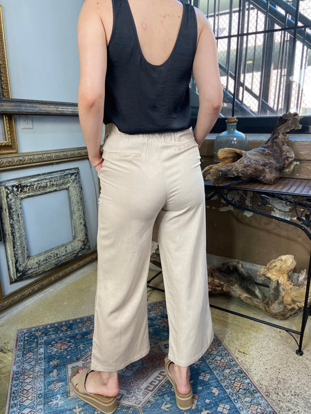 sylvie khaki linen pants with pockets double button linen pants paired with black blouse shirt