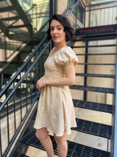 Introducing the Taryn Khaki Daisy Mini Dress – your go-to piece for effortless chic style! This dress combines a playful daisy print with a flattering mini silhouette that’s perfect for any occasion. Whether you're headed to brunch or a summer picnic, you'll love how easy it is to style.

- Light and breathable fabric for all-day comfort
- Flattering mini length for a trendy look
- Playful daisy print adds a touch of fun
- Versatile for both casual and dressy outings
- Pair it with sandals or heels for any 