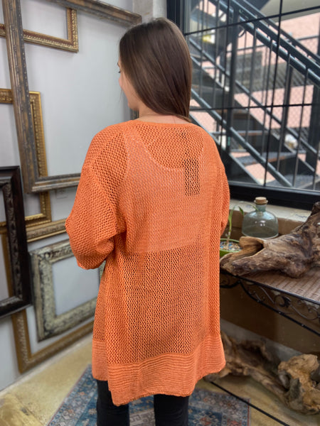 orange mesh cardigan light comfortable cover up paired with black jeans and white tank top