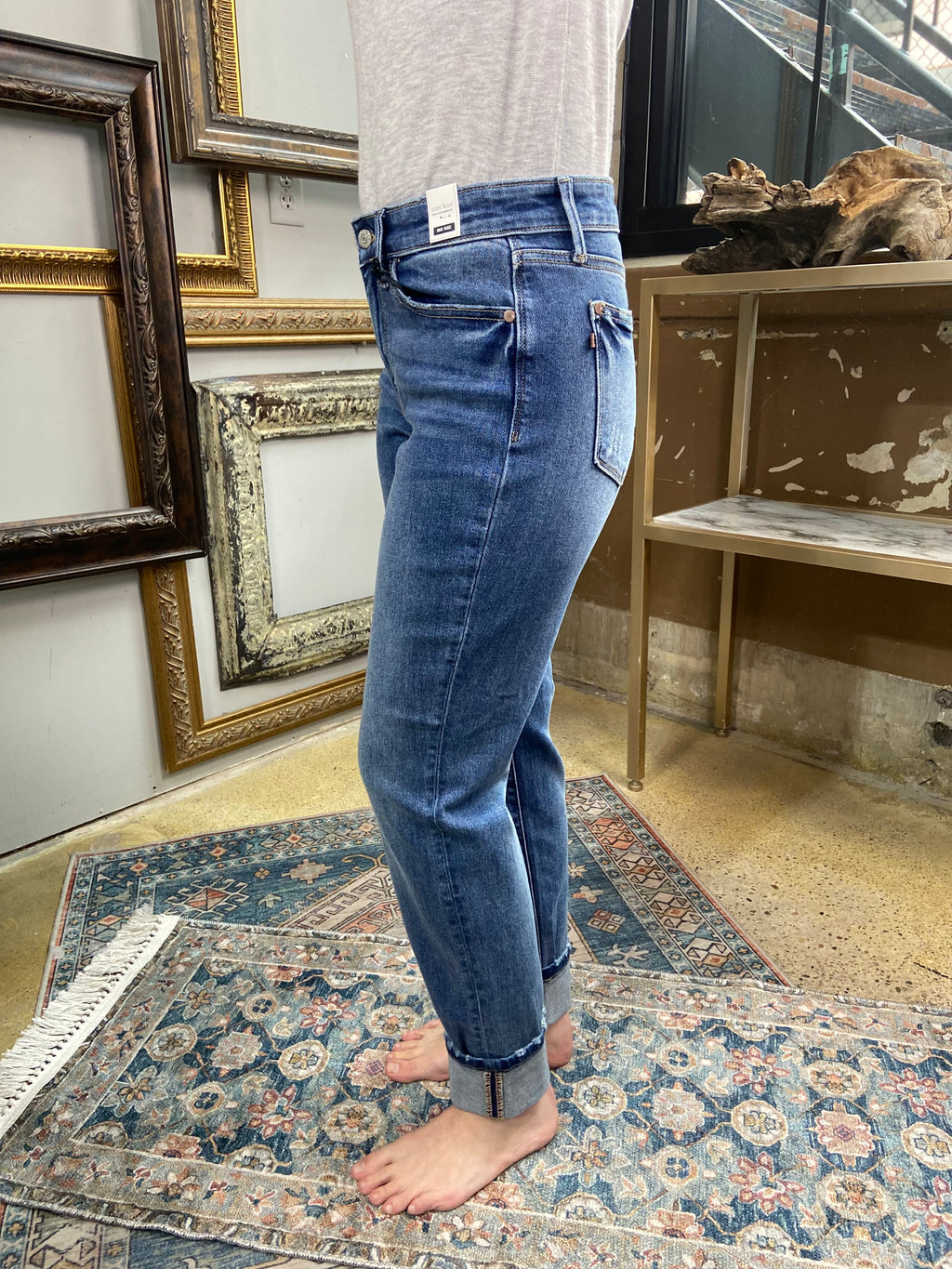 judy blue jeans boyfriend fit cuffed bottom dark to medium wash paired with gray long sleeve